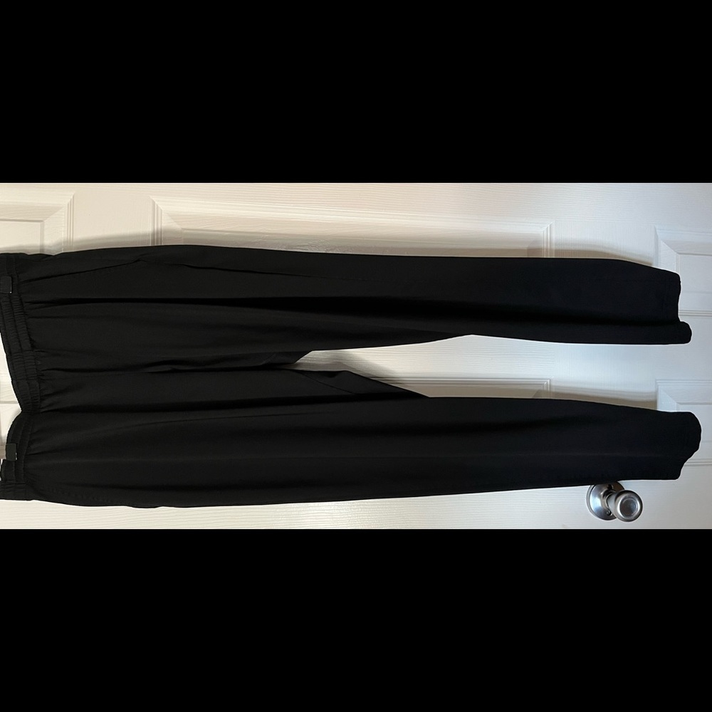 Varsity black joggers with zippers on the bottom